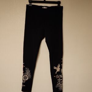 Classic black leggings with chic embroidery by JOHNNY WAS.